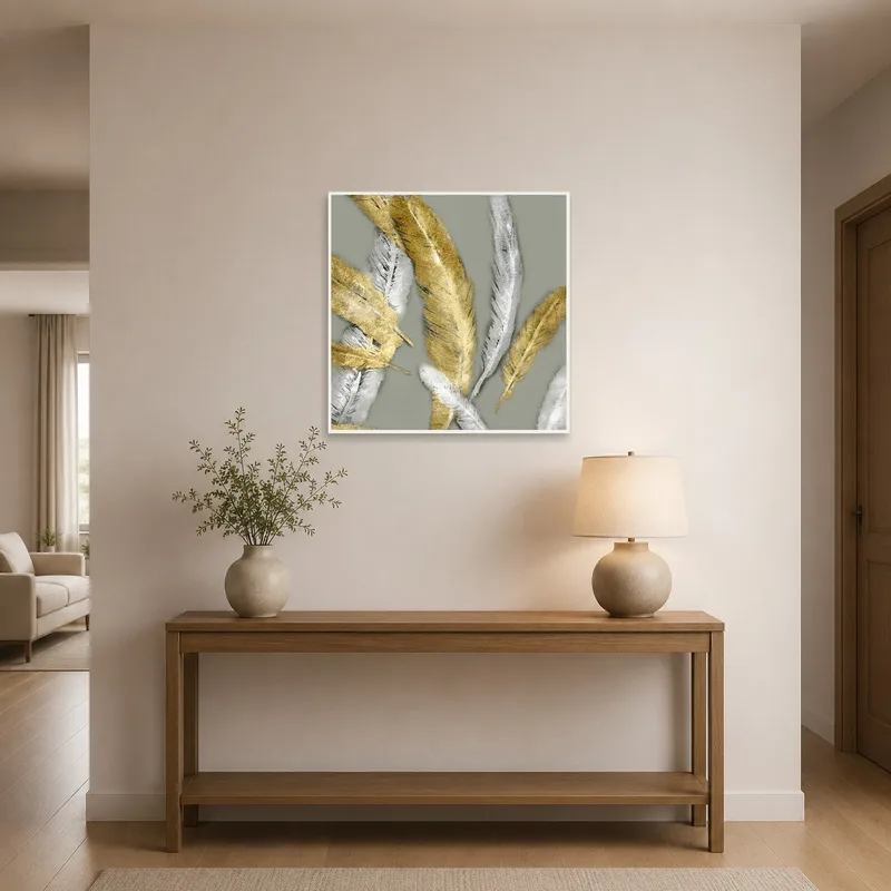 Artwork featuring golden and silver feathers welcomes guests in a stylish entrance hall.