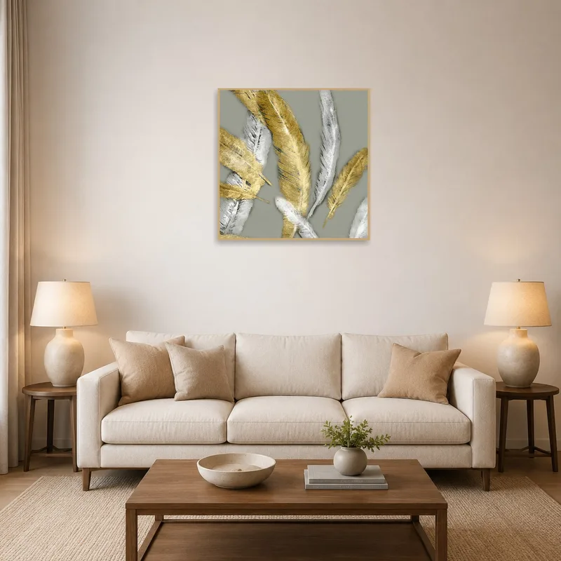 Golden and silver feather artwork adds elegance above a sleek gray sofa in the living room.