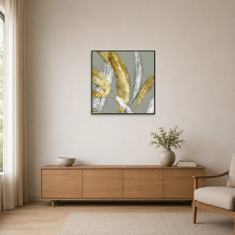 Golden and silver feather artwork complements the clean lines of a minimalist setting.
