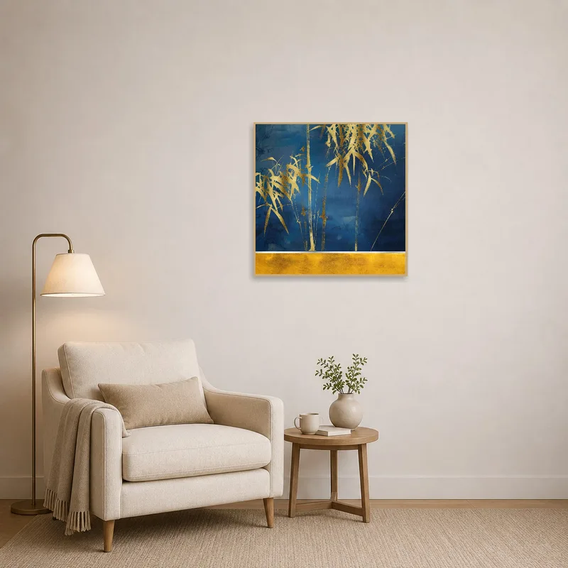 Golden bamboo art adds a calming touch to a reading corner with a cozy armchair.