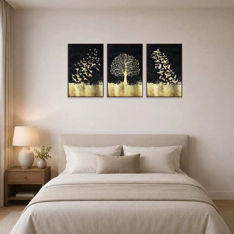 Triptych of golden birds and tree adding charm to a serene bedroom.