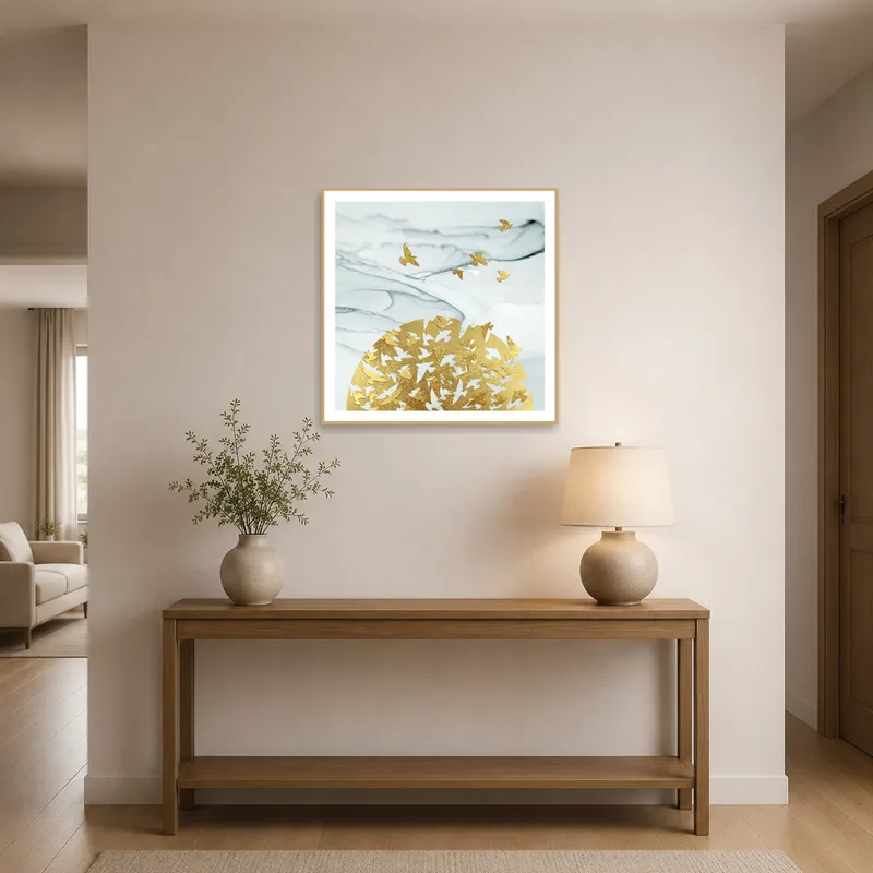 Entrance hall features golden birds on marble artwork welcoming visitors.