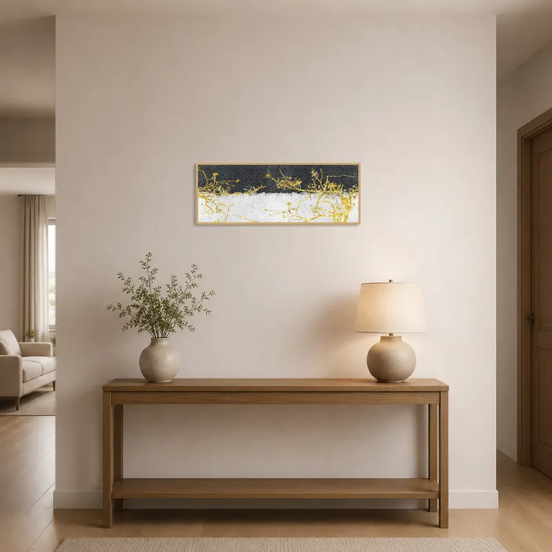 Entrance hall adorned with golden botanical branches on a textured surface.
