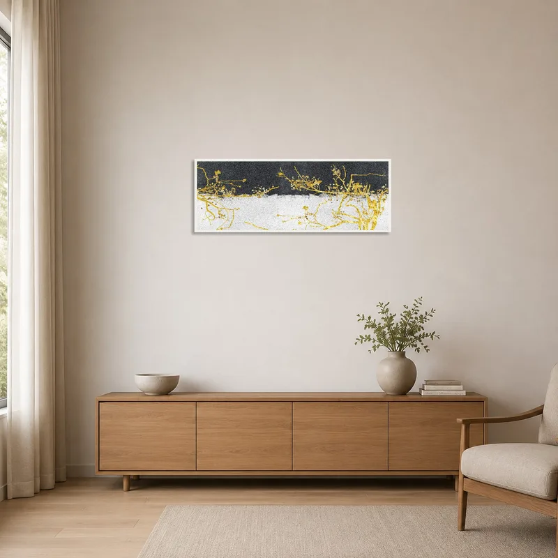 Minimalist space featuring golden botanical branches against a textured backdrop.