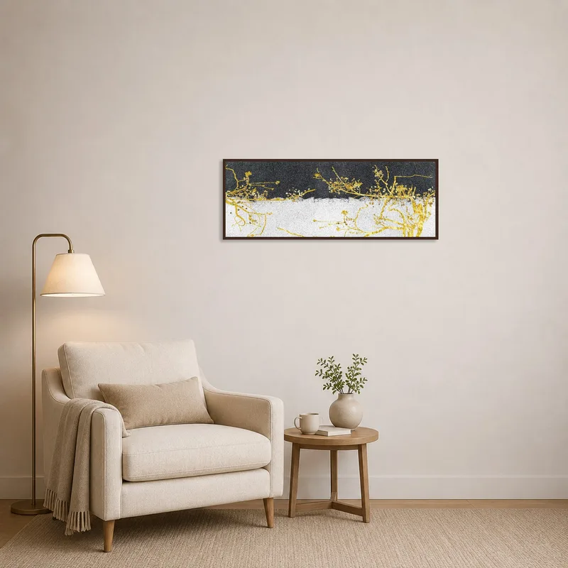 Reading corner accented by golden botanical branches on a textured background.