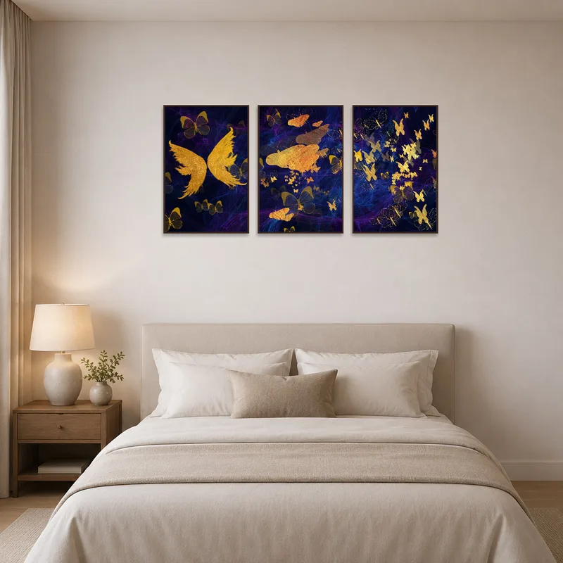 Golden Butterfly Triptych creating warmth above a bed in a tranquil bedroom.