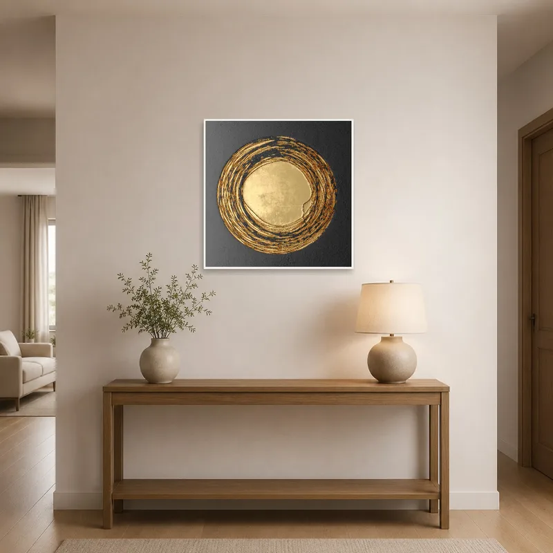 Golden circular abstract piece enhancing an entrance hall wall.
