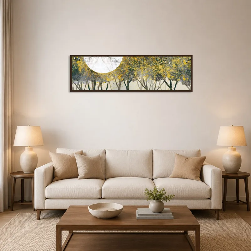 Golden forest panoramic print with moon above a living room sofa and coffee table.