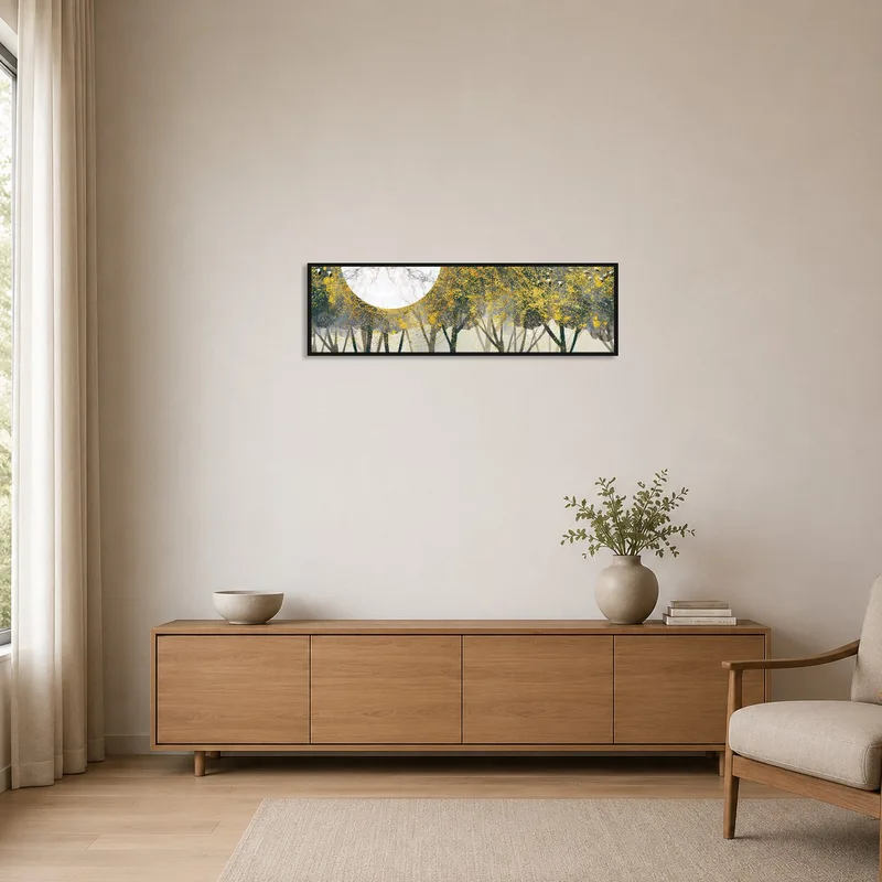Minimalist room with golden forest and moon artwork on a blank white wall.