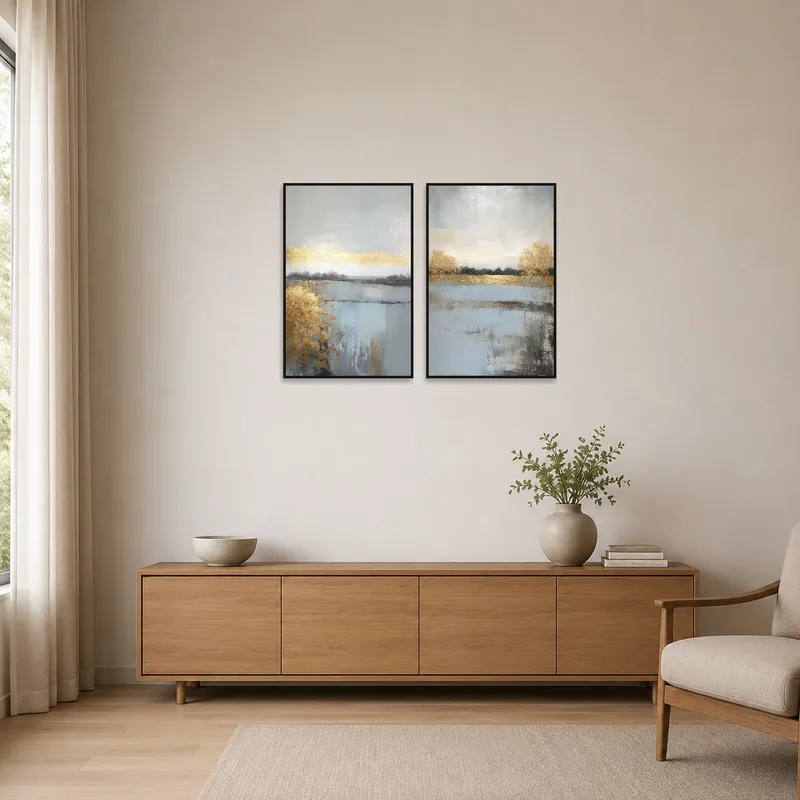 Golden triptych accents a minimalist room with subtle elegance.