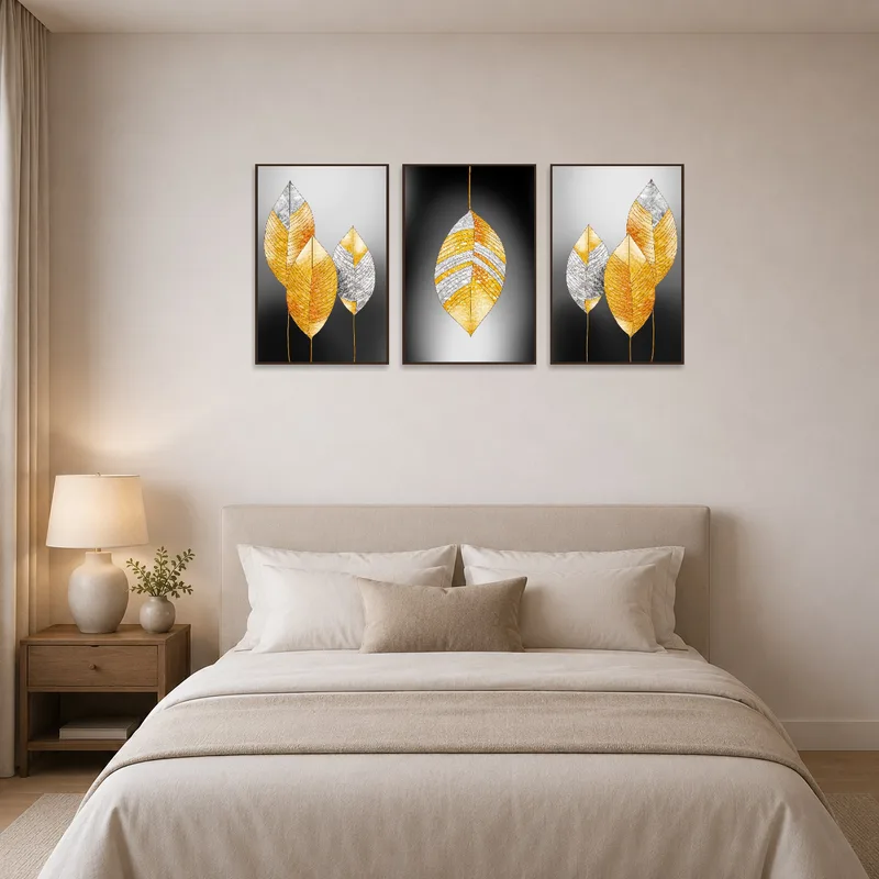 The bedroom wall is graced by a golden leaf abstract triptych set.