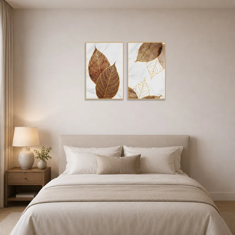Golden leaf set on marble adds a touch of luxury above a bedroom headboard.