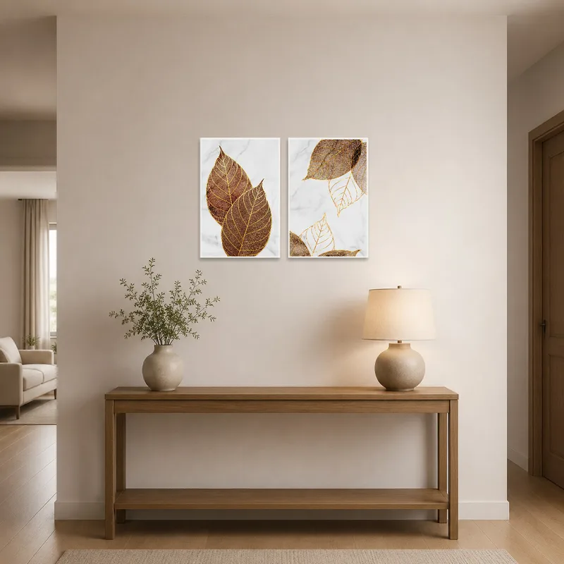 Golden leaf and marble artwork set illuminating the entrance hall with a touch of elegance.