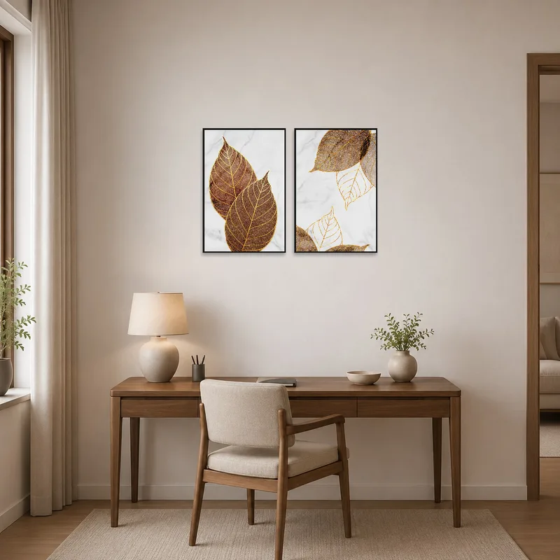 Golden leaf artwork set enhances a home office, adding elegance to the workspace decor.