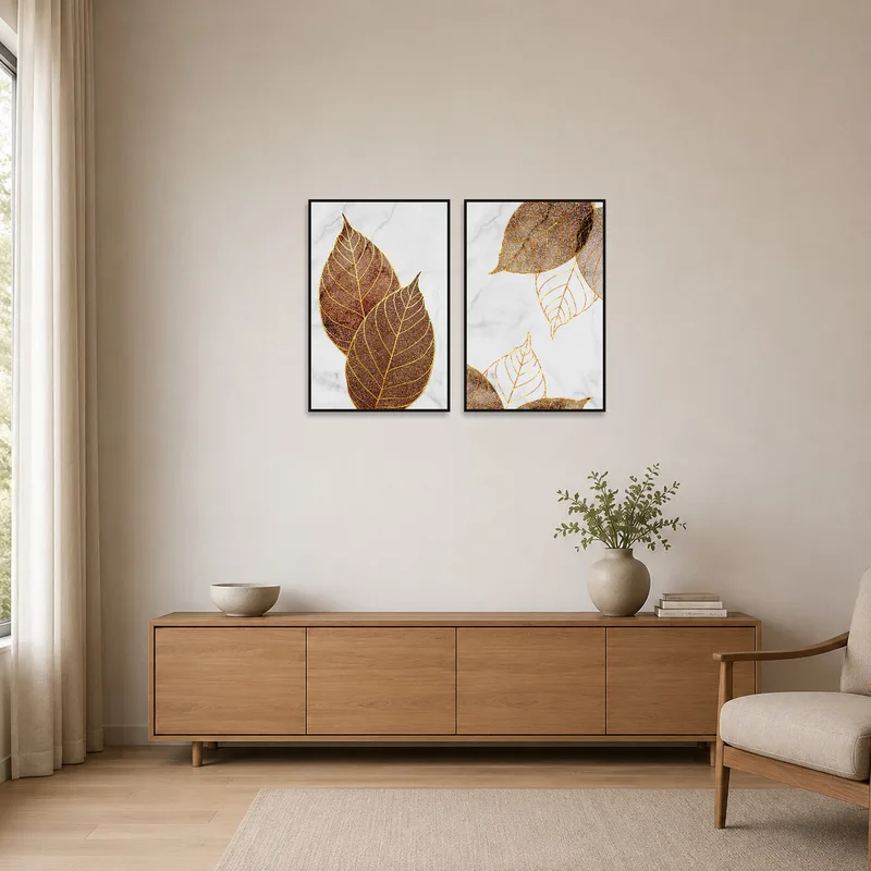 Golden leaf artwork set on a marble backdrop in a minimalist room with simple furniture.
