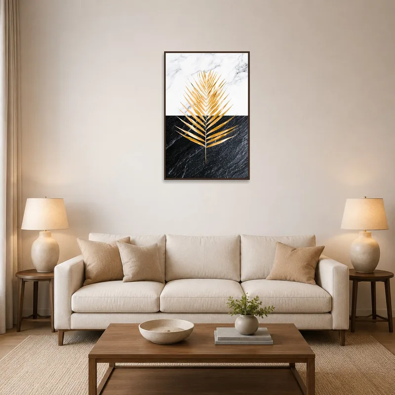 Artwork of a golden palm leaf on marble and slate in a modern living room.