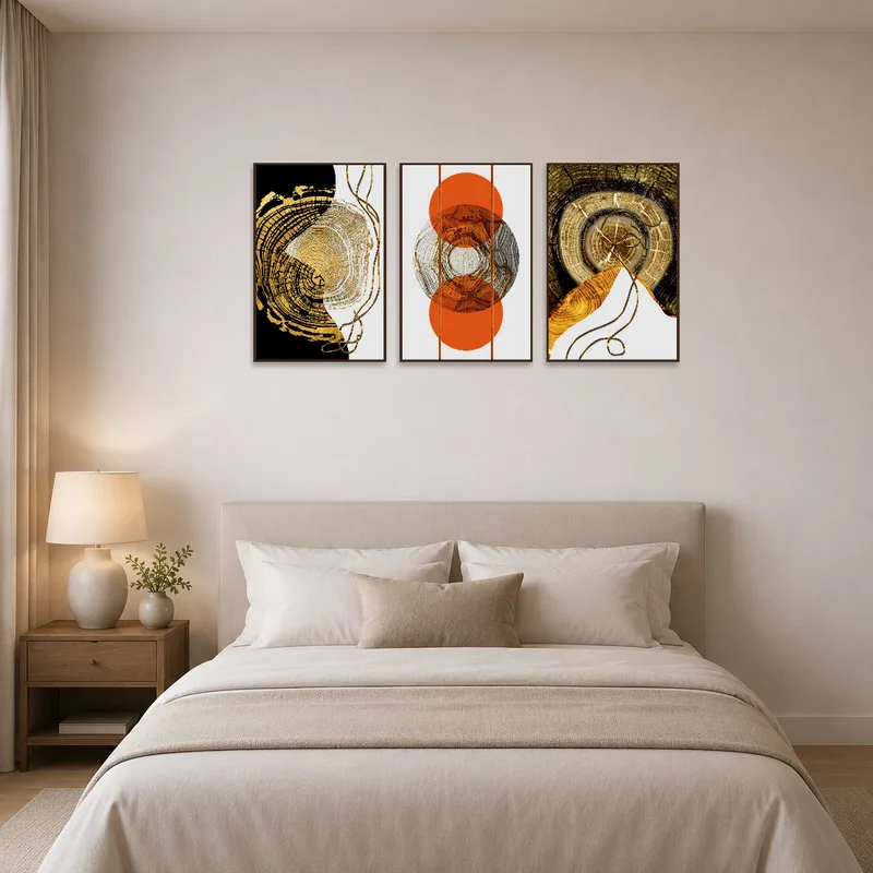 Golden Rings Triptych in a bedroom, bringing warmth and elegance to a serene sleeping space.