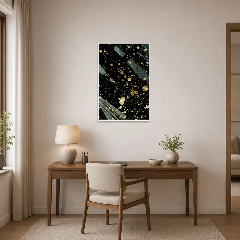 Bold golden splatter art on black enhancing a creative home office space.