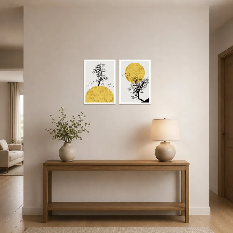 Entrance hall featuring a set of golden sun and tree silhouette prints, greeting visitors with elegance.
