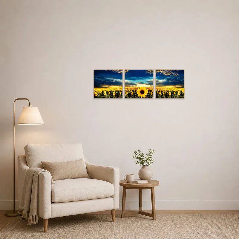 A reading corner adorned with the 'Golden Sunflower Fields at Dusk Triptych Set', creating a cozy atmosphere.