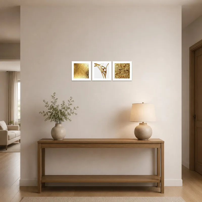 Entrance hall with a captivating golden textures triptych set, welcoming guests with style.