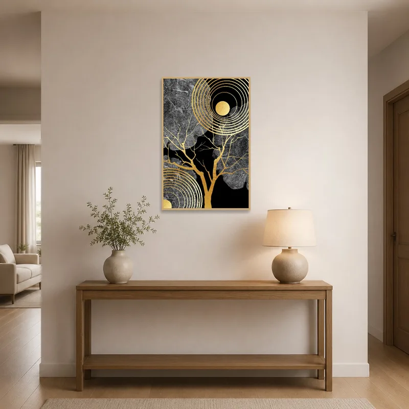 Golden tree rings and sunburst art accentuating an entrance hall with a sleek console table.