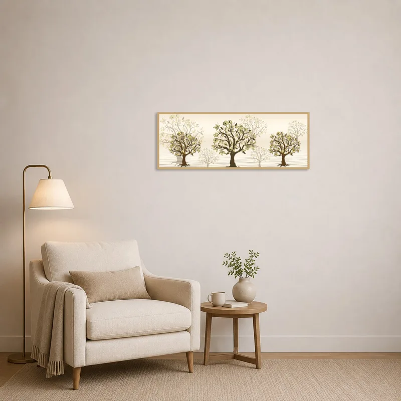 Golden tree silhouettes art on the wall beside a cozy chair and lamp in a reading corner.