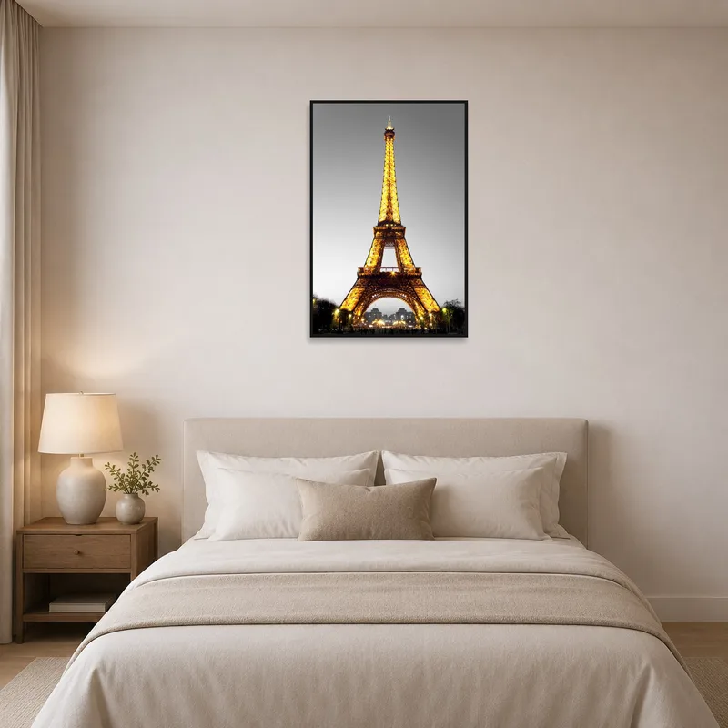 Eiffel Tower print enhances bedroom ambiance above the headboard.