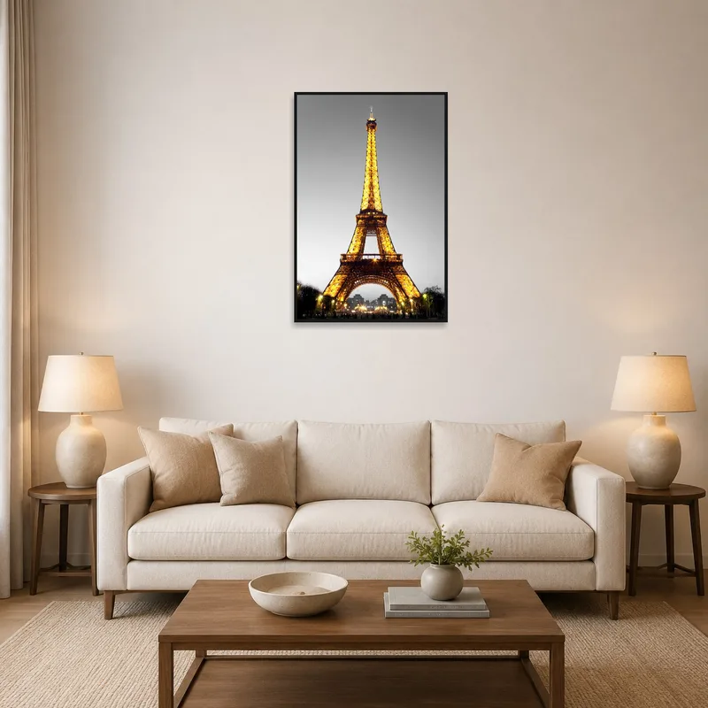 Eiffel Tower print on living room wall above a modern sofa.