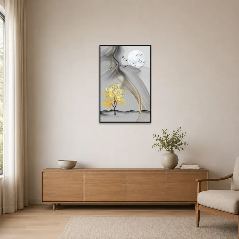 Tree and moon art print on a minimalist room wall with simple furnishings.
