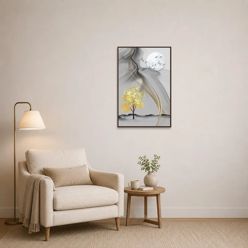 Art print of tree and moon hanging above a comfortable reading chair.