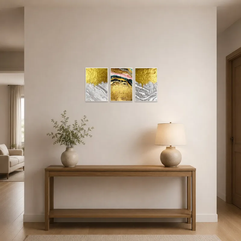Majestic abstract triptych hanging in an entrance hall next to a chic console table.