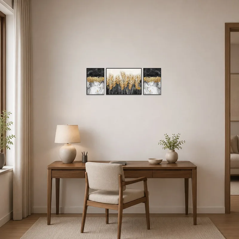Abstract gold and black triptych adds sophistication to a home office wall.