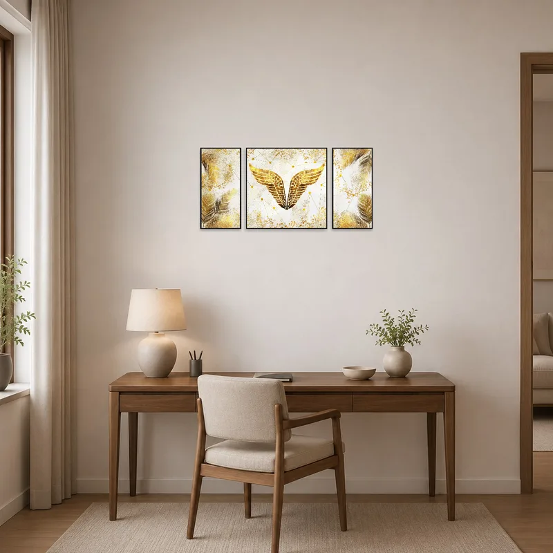 Sophisticated gold feather and wing triptych in a stylish home office.