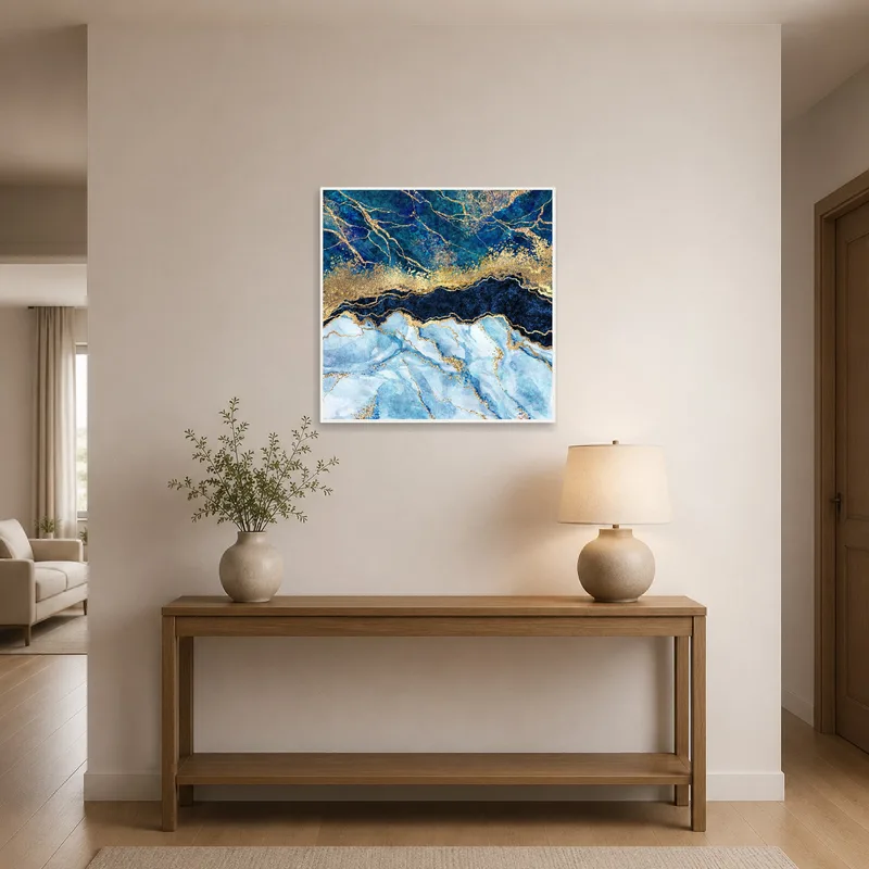 Abstract blue and gold marble art print elegantly displayed in entrance hall.