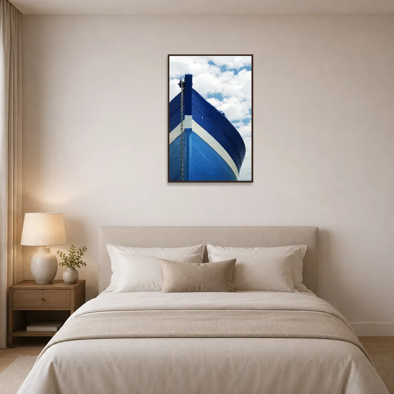 Dreamy ship and sky image evokes calm in the bedroom.