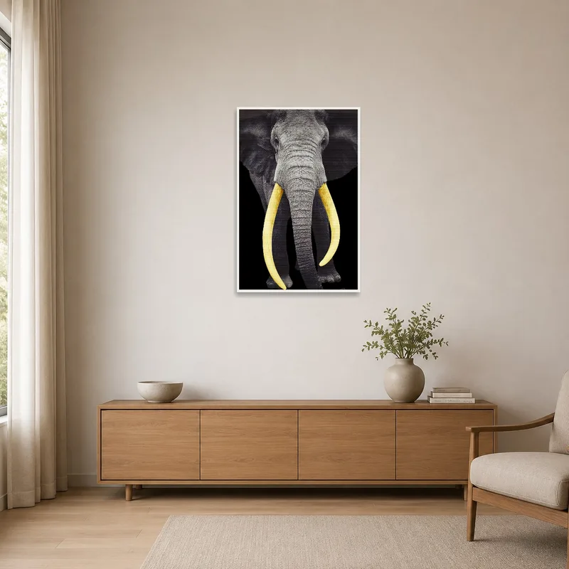 Elephant with golden tusks art piece in a clear, minimalist space.