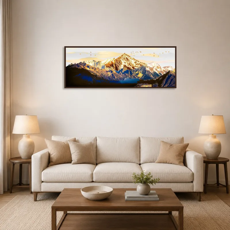 Majestic mountain range art print above a modern sofa in the living room.