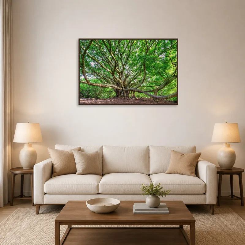 Panoramic art of a sprawling tree hanging above a modern living room sofa.
