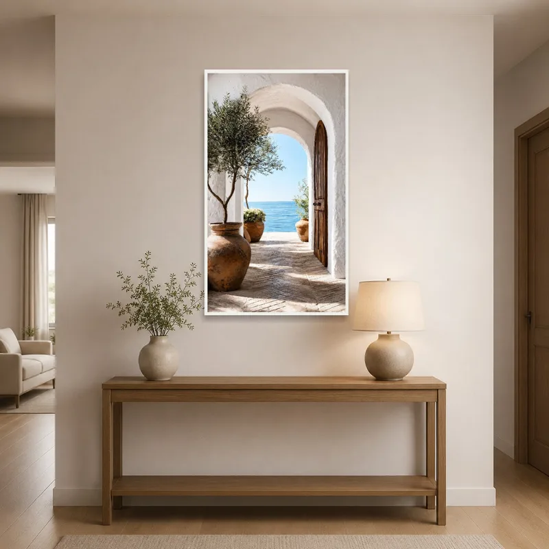 Art print of a sea view through an archway in an entrance hall.