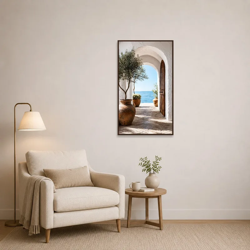Art print depicting a Mediterranean archway with a sea view in a reading corner.