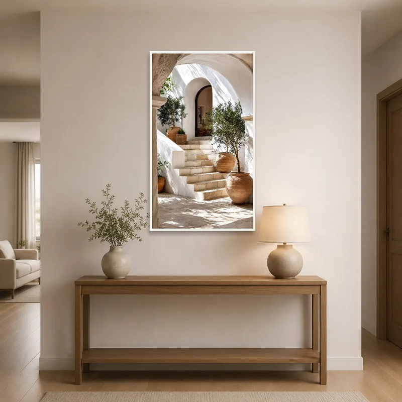 Entrance hall adorned with an art print of a Mediterranean courtyard with olive trees.