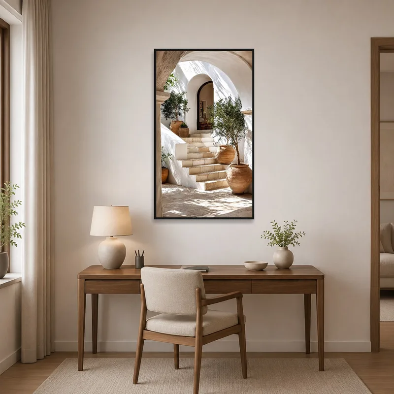 Home office enhanced by an art print of a Mediterranean courtyard with olive trees.