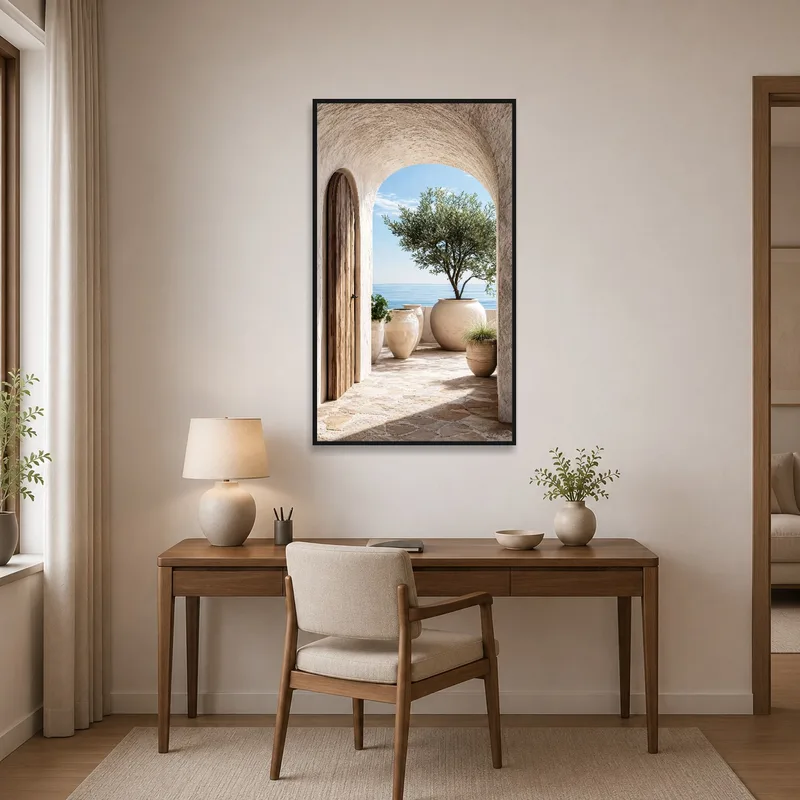Home office with a scenic view of a Mediterranean terrace and blue sea.