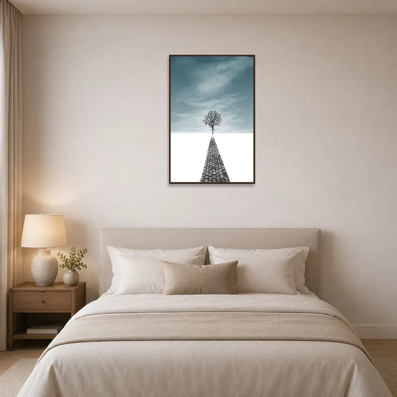 A peaceful tree and path print is displayed in a serene bedroom.