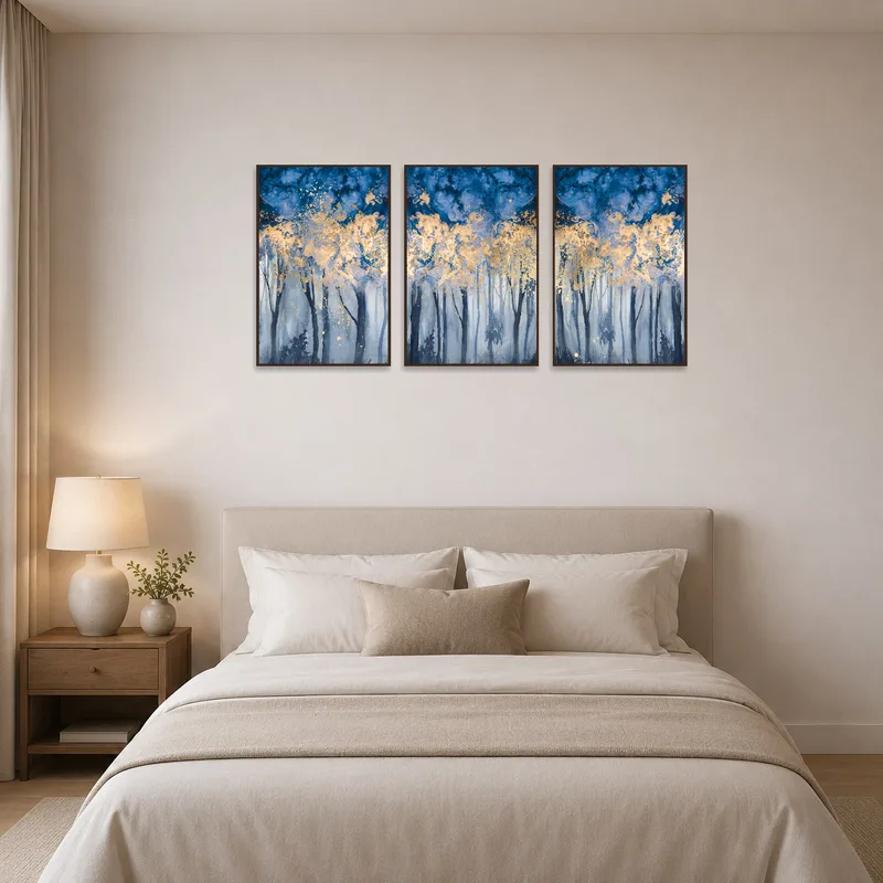 Triptych depicting a misty blue forest hangs elegantly in a tranquil bedroom.
