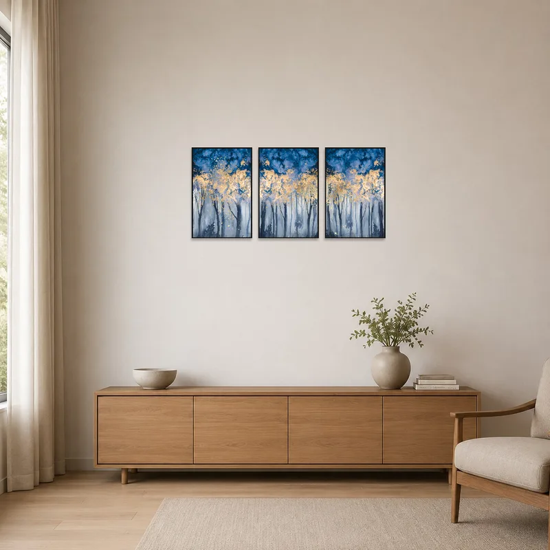 Triptych of a misty blue forest with gold details in a minimalist room setting.