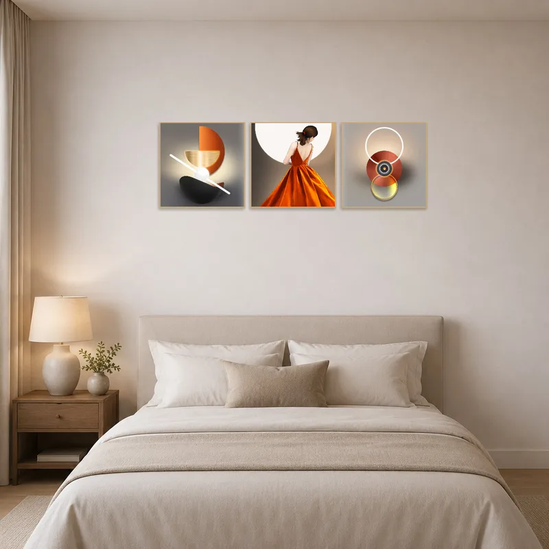 Bedside wall decorated with a modern triptych art set for a relaxing vibe.