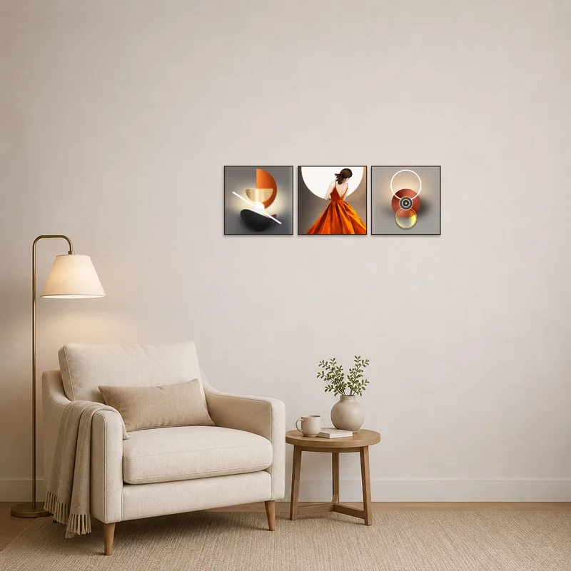 Reading corner with a calming abstract triptych hung beside a comfy chair.