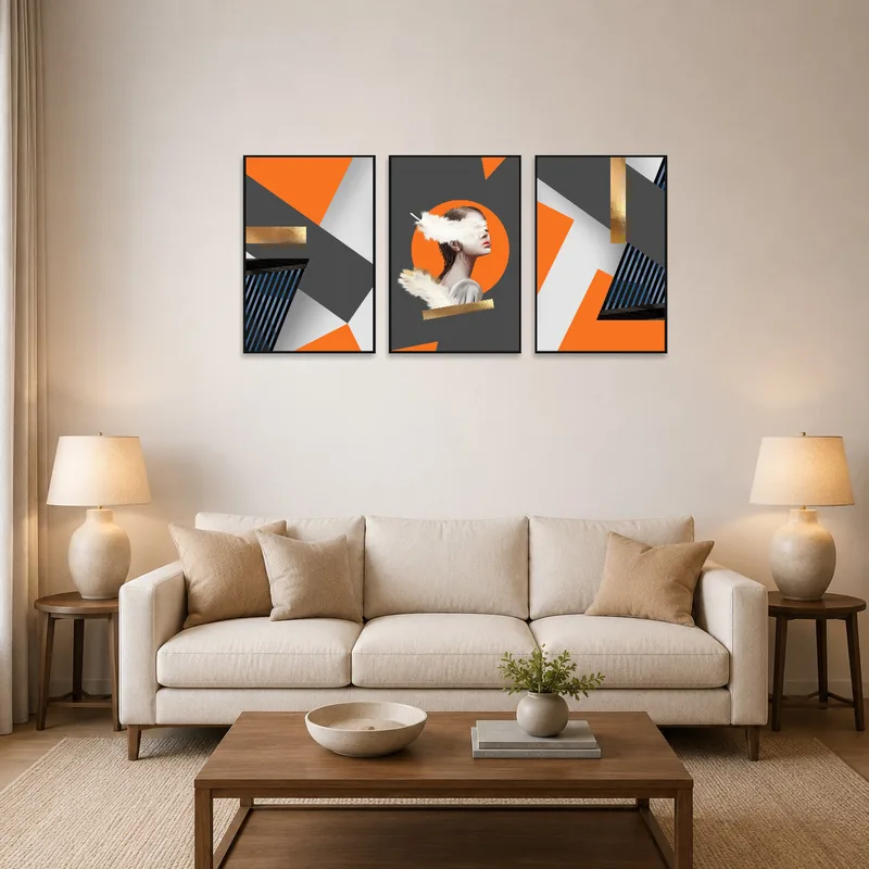 A modern abstract triptych with orange and gold accents on a living room wall.